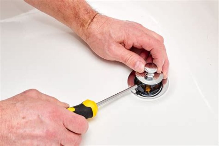 how to remove drain stopper from tub